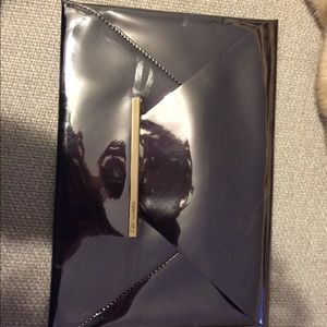 Sold !!!Bcbg silver clutch with tags