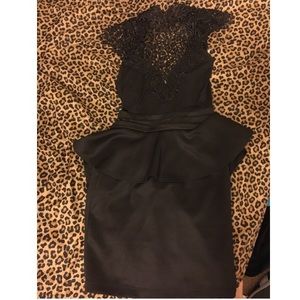 Tight black peplum dress fits sizes 4-6