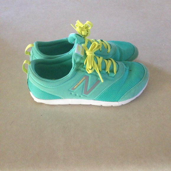 Mint green and yellow new balance shoes
