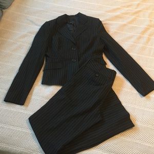 Pinstriped black suit