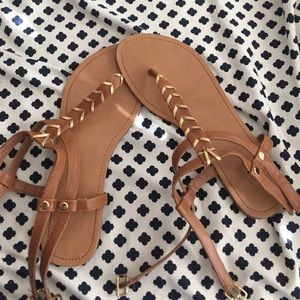 gold and tan sandals