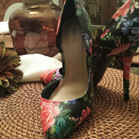 Floral print has dark red light pink ,blue flowers