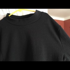 Black long sleeve crop top, slight turtle neck