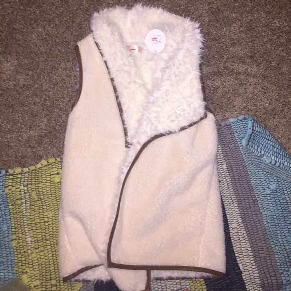 White faux fur vest