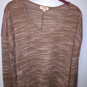 Long sleeve, very cute and flattering top.
