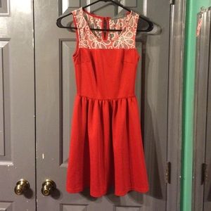 Dress with sheer flower pattern at the top