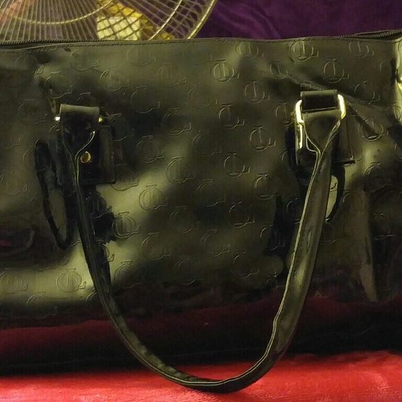 A blk large QL hand bag