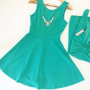 Solid bow back dress