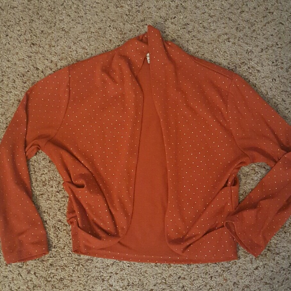 Orange shrug with gold dots