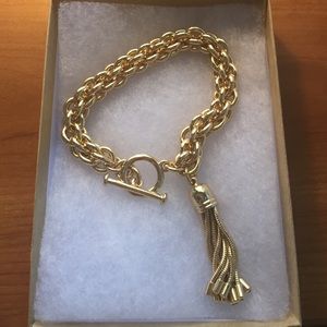 Kate Spade Gold tone bracelet with tassel
