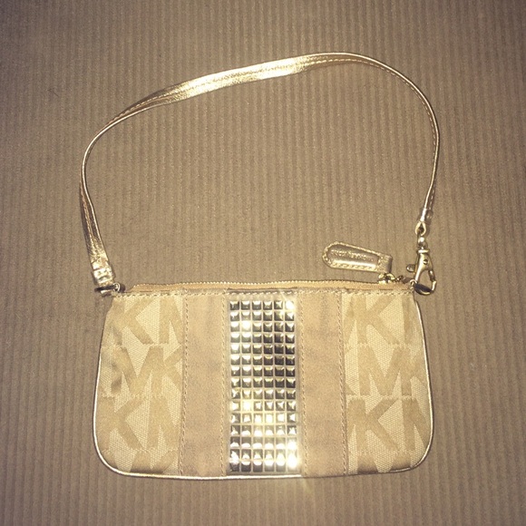 Tan and gold Michael Kors wristlet.