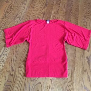 Red oversized sleeved top.