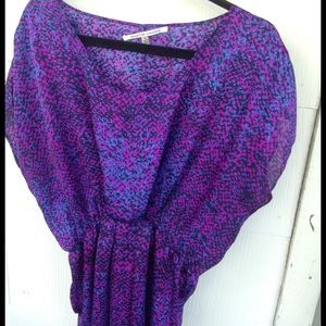 Purple cinched waist dress.