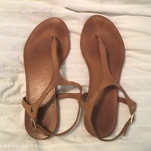Brown Aldo T-strap sandals.