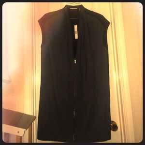 A remarkable, never been worn sleek black dress