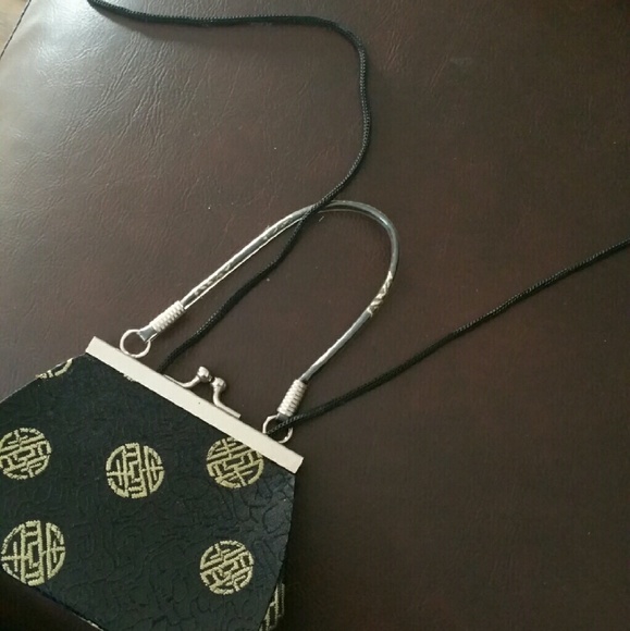 Black and gold small aidan style purse