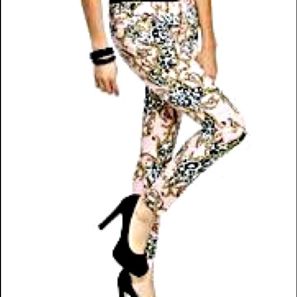 Light pink pants with swirl design.