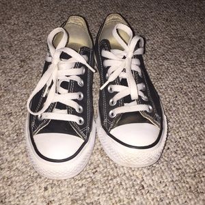 Worn Black/White Converse.