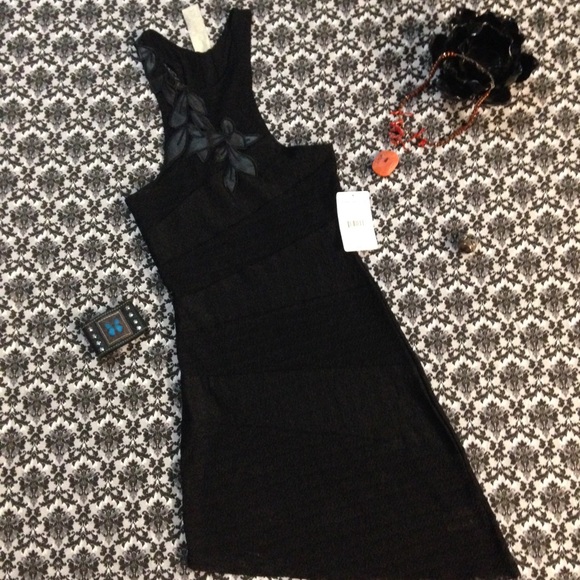 NWT Free People tunic in black heat size XS.