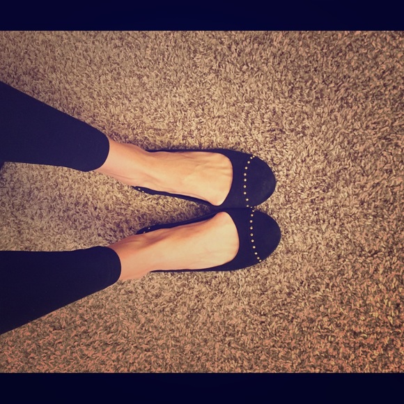 Black flats with gold detail