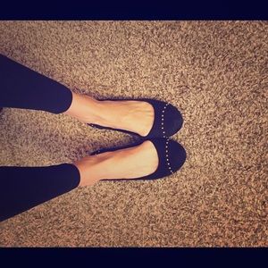 Black flats with gold detail