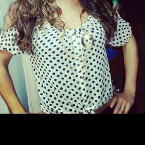 Black and white crop top. Gold buttons.