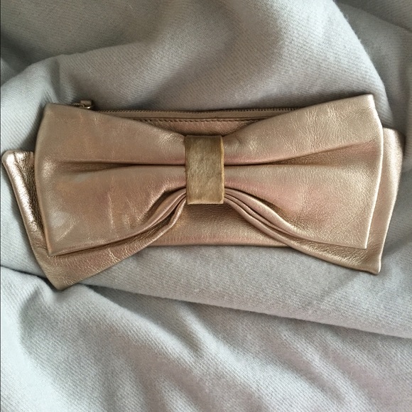 Kate spade Gold leather clutch with big cute bow