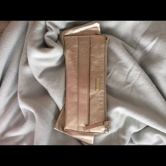 Kate spade Gold leather clutch with big cute bow