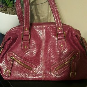 Detailed with gold zippers snakeskin type purse