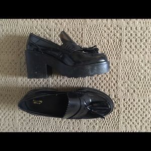 Black tasseled heeled loafers