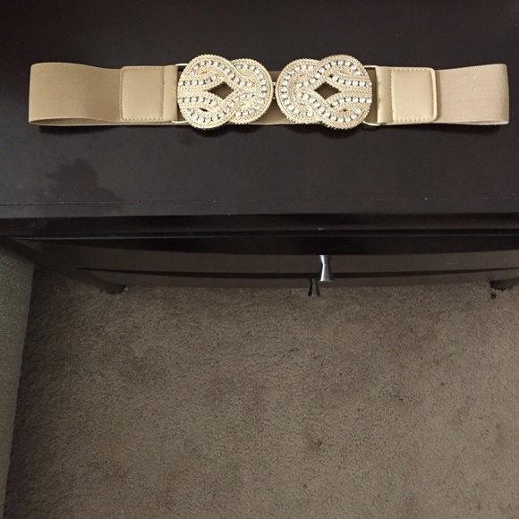 Decorative tan belt with emblem