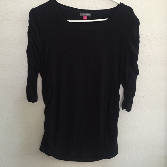 3/4 sleeve top with shirred sleeves and waist.
