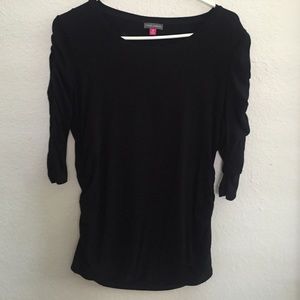 3/4 sleeve top with shirred sleeves and waist.