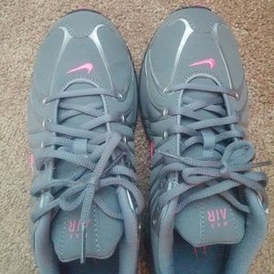 Pink and Gray Nike tennis shoes size 8. Worn once.