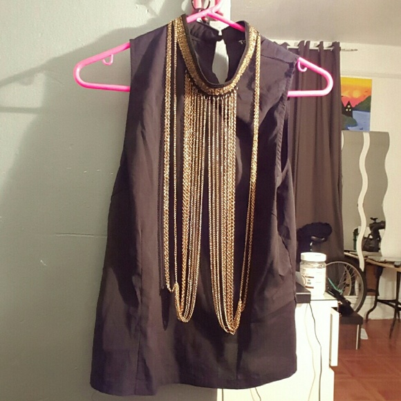 Sleeveless top with gold detail in front