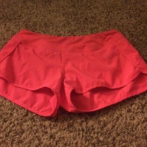 Pink Wodlife athletic shorts.