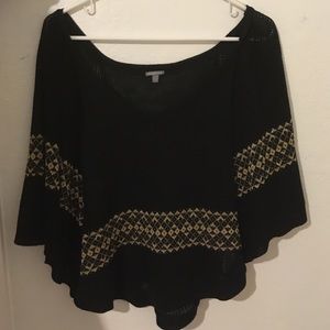 A black and gold poncho shirt