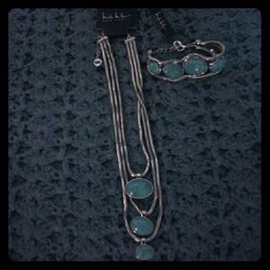 Silver Nicole miller set