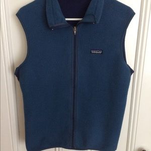 Blue Patagonia Vest with pocket on back.