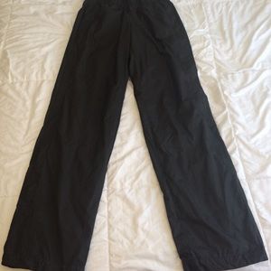 Nike black swooshy pants.