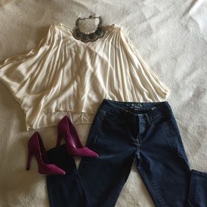 Cream tank with large open arms