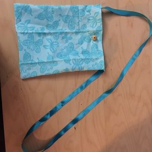 A beautiful Turquoise cross body butterfly purse.