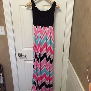Super cute maxi dress, bright colored skirt. Med