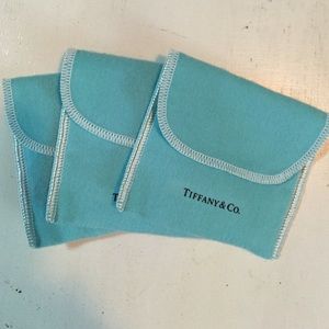 Three Tiffany and Co jewelry dustbags and bags