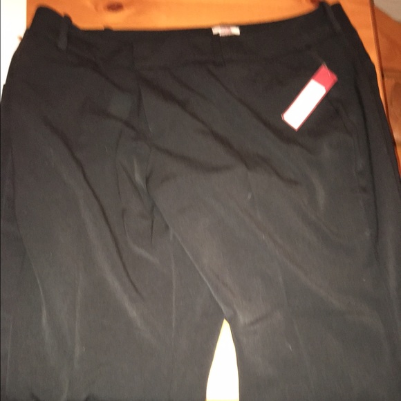 two pairs of black work pants