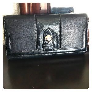 Coach black leather wallet with lilac interior.