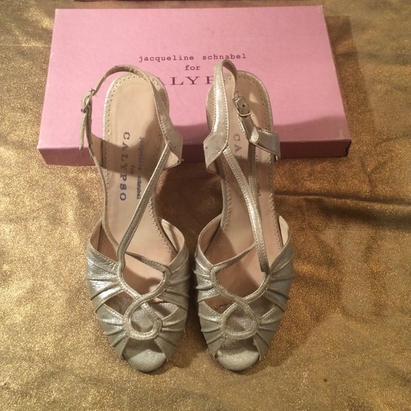 Chic silver Calypso wedge sandal. Heel 2 7/8"