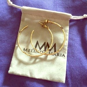 Melinda Maria gold hoop earrings with crystals.