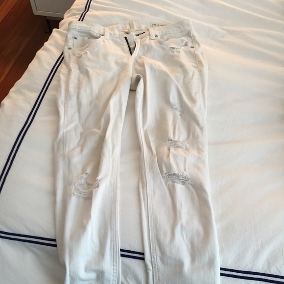 Rag and Bone skinny white jeans with rips