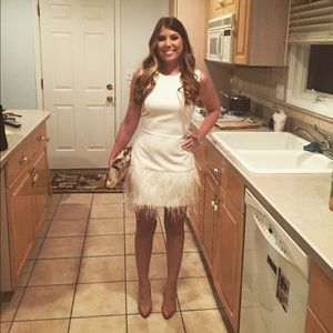 Elizabeth and James White dress with feathers